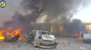 A still image taken from a video uploaded by White Helmets, shows vehicles on fire at the site of a car bomb, said to be in the town of al-Dana