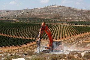Heavy machinery work on a field as they begin construction work of Amichai, a new settlement which will house some 300 Jewish settlers evicted in February from the illegal West Bank settlement of Amona, in the West Bank