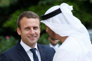 French President Emmanuel Macron accompanies Abu Dhabi's Crown Prince Sheikh Mohammed bin Zayed al-Nahyan after a meeting about Qatar crisis at the Elysee Place in Paris