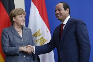 German Chancellor Merkel and Egypt's President Sisi shake hands following a news conference in Berlin
