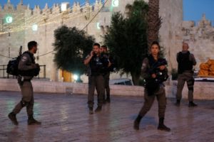 Israeli policemen secure the scene of the shooting and stabbing attack outside Damascus gate in Jerusalem's old city