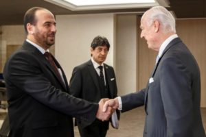 UN Special Envoy of the Secretary-General for Syria Staffan de Mistura shakes hands with Syria's main opposition HNC leader Nasr al-Hariri prior to a round of negotiations at the European headquarters of the United Nations in Geneva