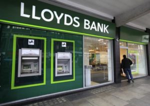 A man enters a Lloyds Bank branch in central London