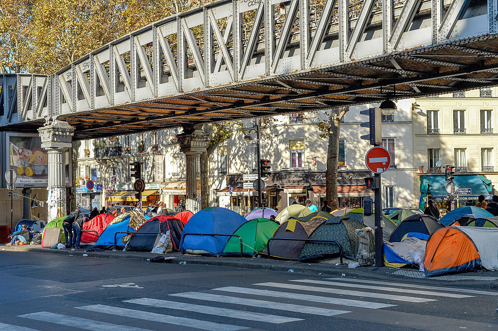 Police Evict Thousands of Migrants from Paris Sidewalks