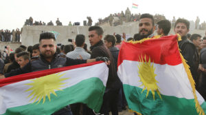 Kurdish residents hold flags during Norouz celebrations in Kirkuk, north of Baghdad.