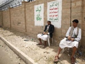 Members of al-Houthi group sit while guarding a group meeting in Sanaa September 16, 2012.