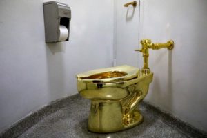 Maurizio Cattelan's "America," a fully functional solid gold toilet is seen at The Guggenheim Museum in New York