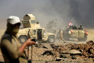 Members of Iraqi army are seen during the war between Iraqi army and Shi'ite Popular Mobilization Forces (PMF) against the Islamic State militants in al-Ayadiya, northwest of Tal Afar