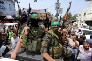 Palestinian Hamas militants attend the funeral of their comrade in Rafah, in the southern Gaza Strip