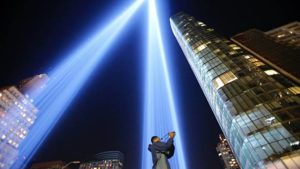 A man takes a picture as the Tribute in Light illuminates the New York City night sky on Sep 10, 2017, on the eve of the anniversary of the September 11, 2001 terror attacks.