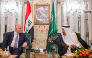 Saudi Arabia's King Salman bin Abdulaziz Al Saud talks with Iraqi Prime Minister Haider al-Abadi in Jeddah