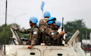 Peacekeepers serving in the MONUSCO patrol in their armoured personnel carrier during demonstrations against Congolese President Joseph Kabila in the streets of DRC capital Kinshasa