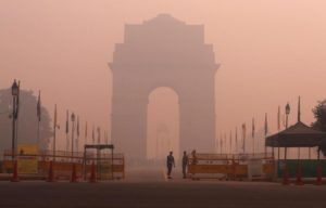 Security personnel stand guard in front of the India Gate amidst the heavy smog in New Delhi