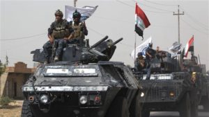 Iraqi forces advance on September 23, 2017 towards the town of al-Hawijah in northern Iraq.